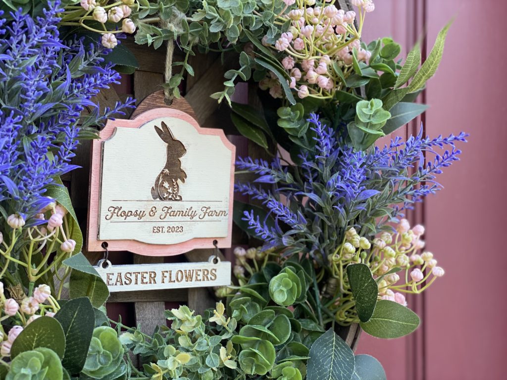 Easter florals DIY inspiration using mini bunny sign within hanging wreath.